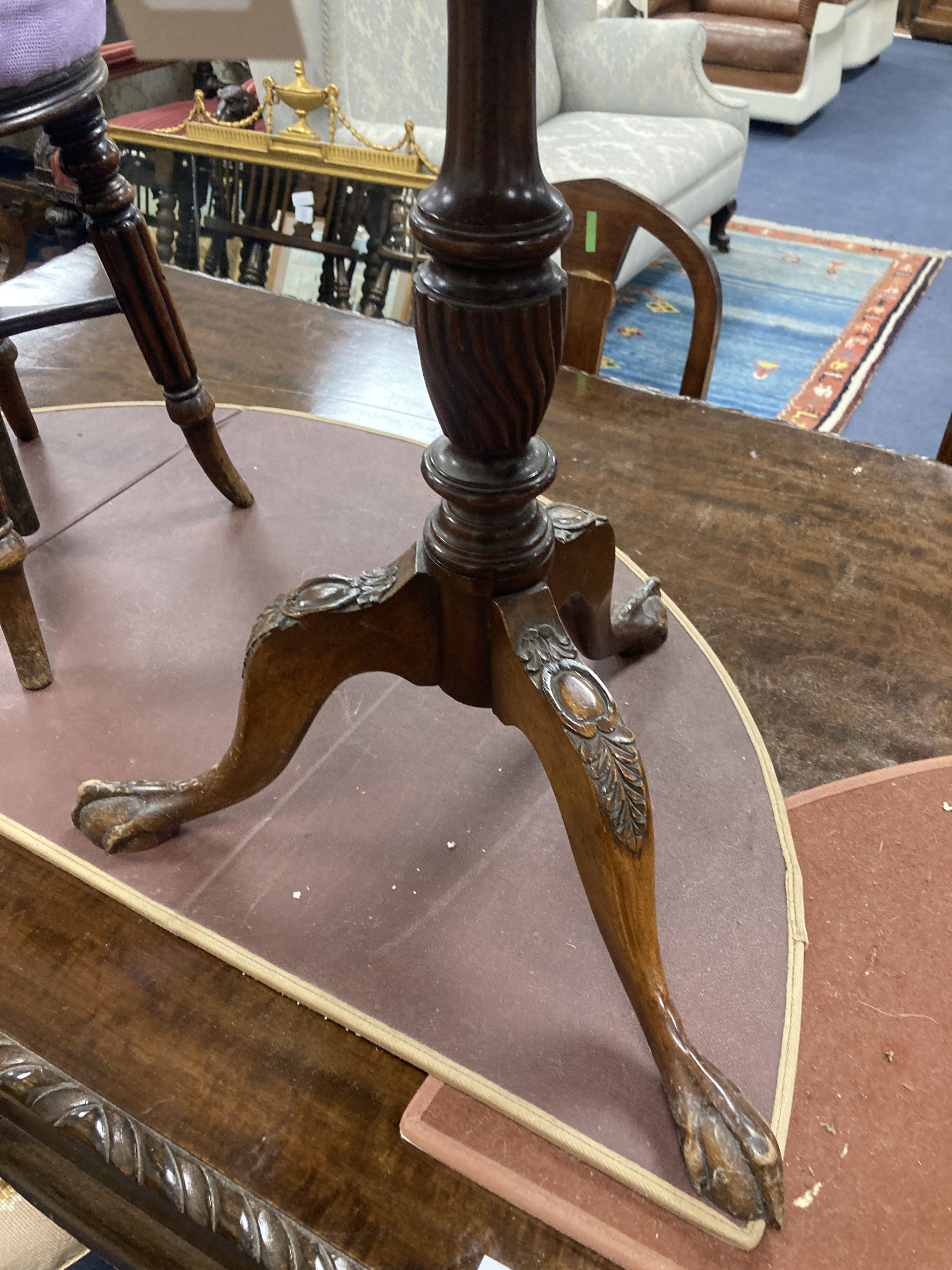 A pair of reproduction George III style mahogany galleried tripod wine tables, 48cm diameter, height 63cm